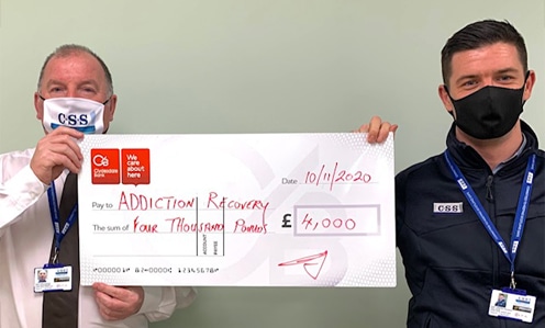 CSS Staff with charity donation cheque for Addiction Recovery Centre