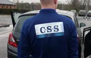 photo of man's back wearing a css branded blue jumper