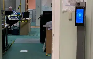 css-temperature-screening at office door entrance