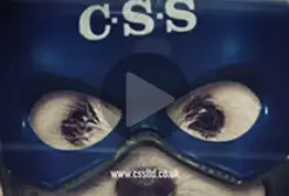 Close up of Buster the dog's eyes in blue CSS helmet.