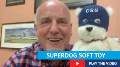 Paul Connelly holding soft toy of Buster the dog, text reads superdog soft, play the video.