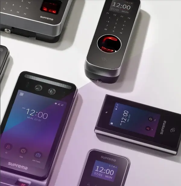 Image of a range of devices and mobile phones showing 12:00 on screen.