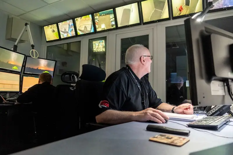 CSS alarm receiving centre (ARC) with members of staff monitoring computers and security screens. Monitored Wireless Home Alarm System | Glasgow and Edinburgh