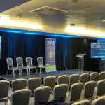A conference room ready for speakers and visitors at the SGF Crime and Wellbeing Seminar 2024 - CSS Team Hampden Security Event
