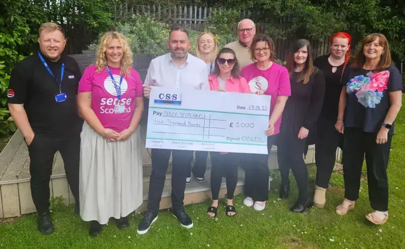 css kiltwalk 2025 team present sense scotland their cheque for five thousand pounds
